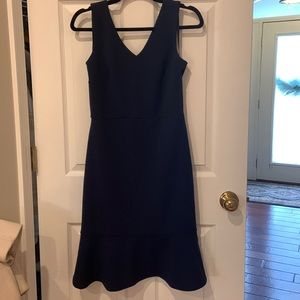 Navy blue sleeveless dress with peplum hem by Banana Republic